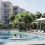 Upscale boomer compound to include lagoon pool, tennis court, yoga studio